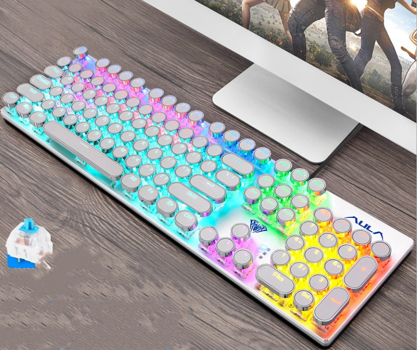 Colorful keyboard on a desk with a computer monitor in the background