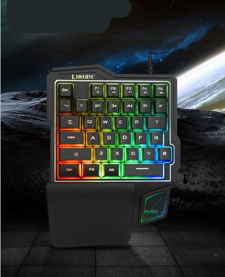 Colorful keyboard with rainbow backlighting on a dark space-themed background