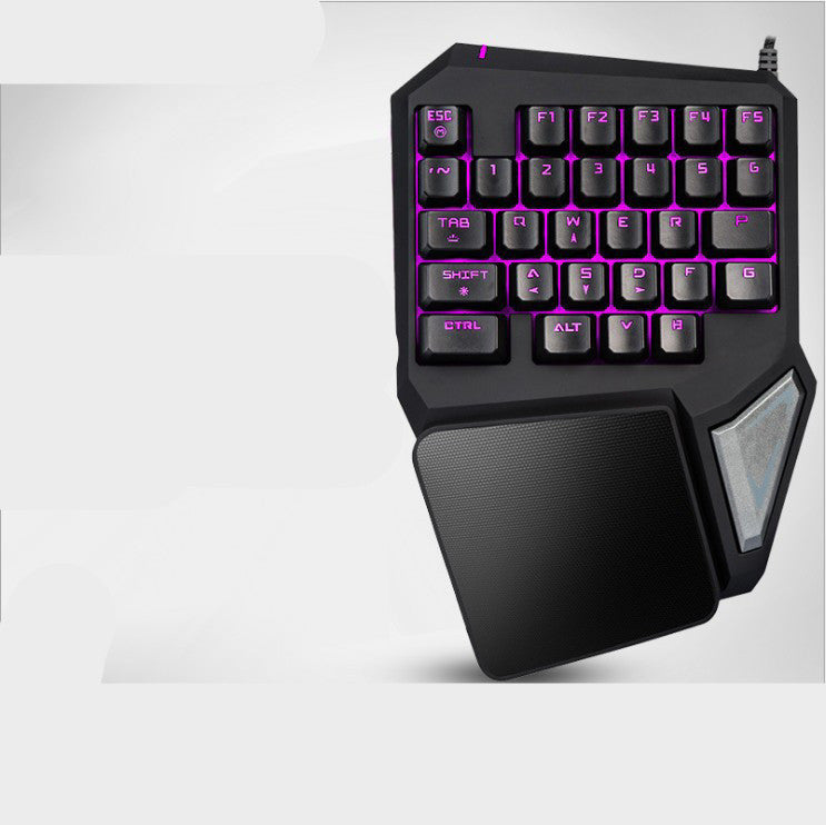 Black gaming keyboard with purple backlighting on a white background