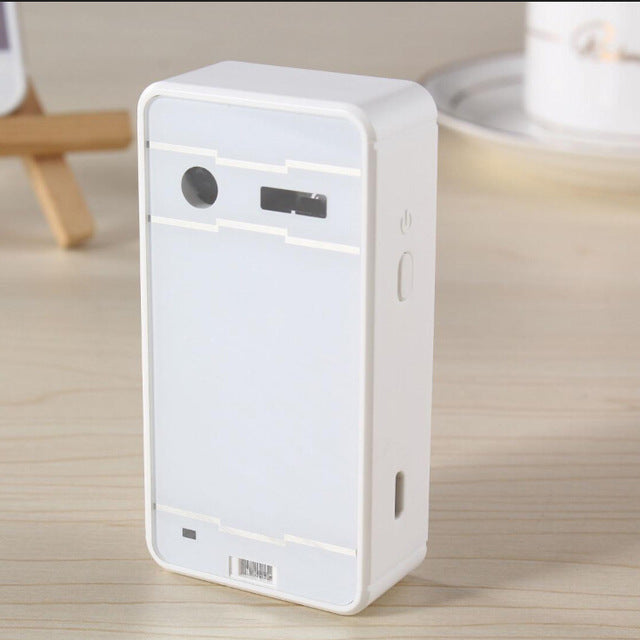 White electronic device on a wooden surface