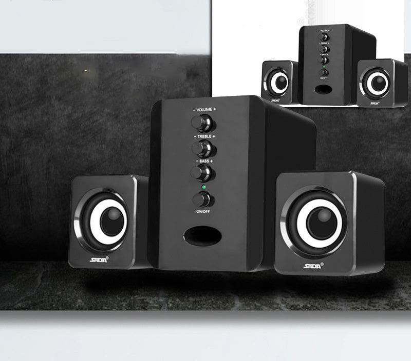 Black speaker system with control buttons on a dark surface