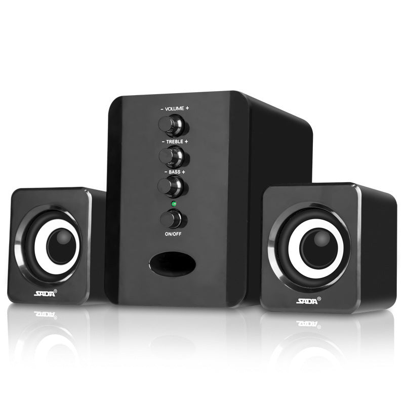 Black computer speakers with control buttons on a white background