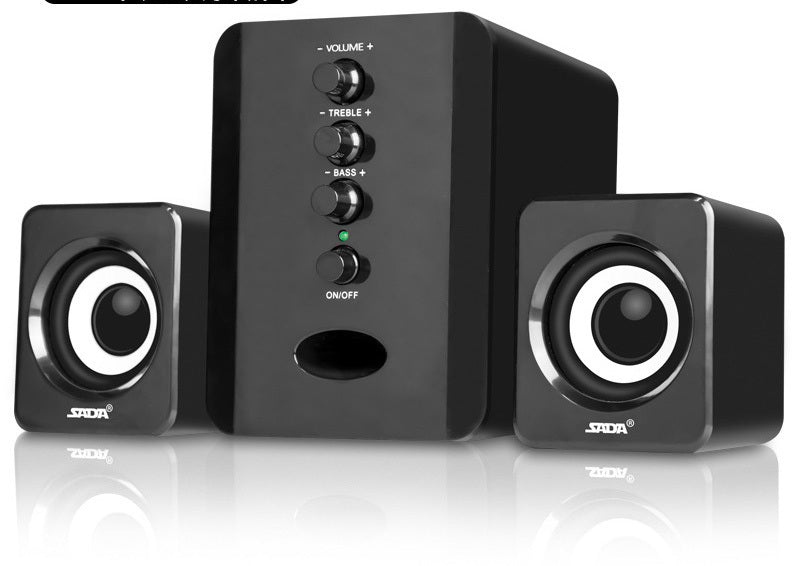 Black computer speakers with control buttons on a white background