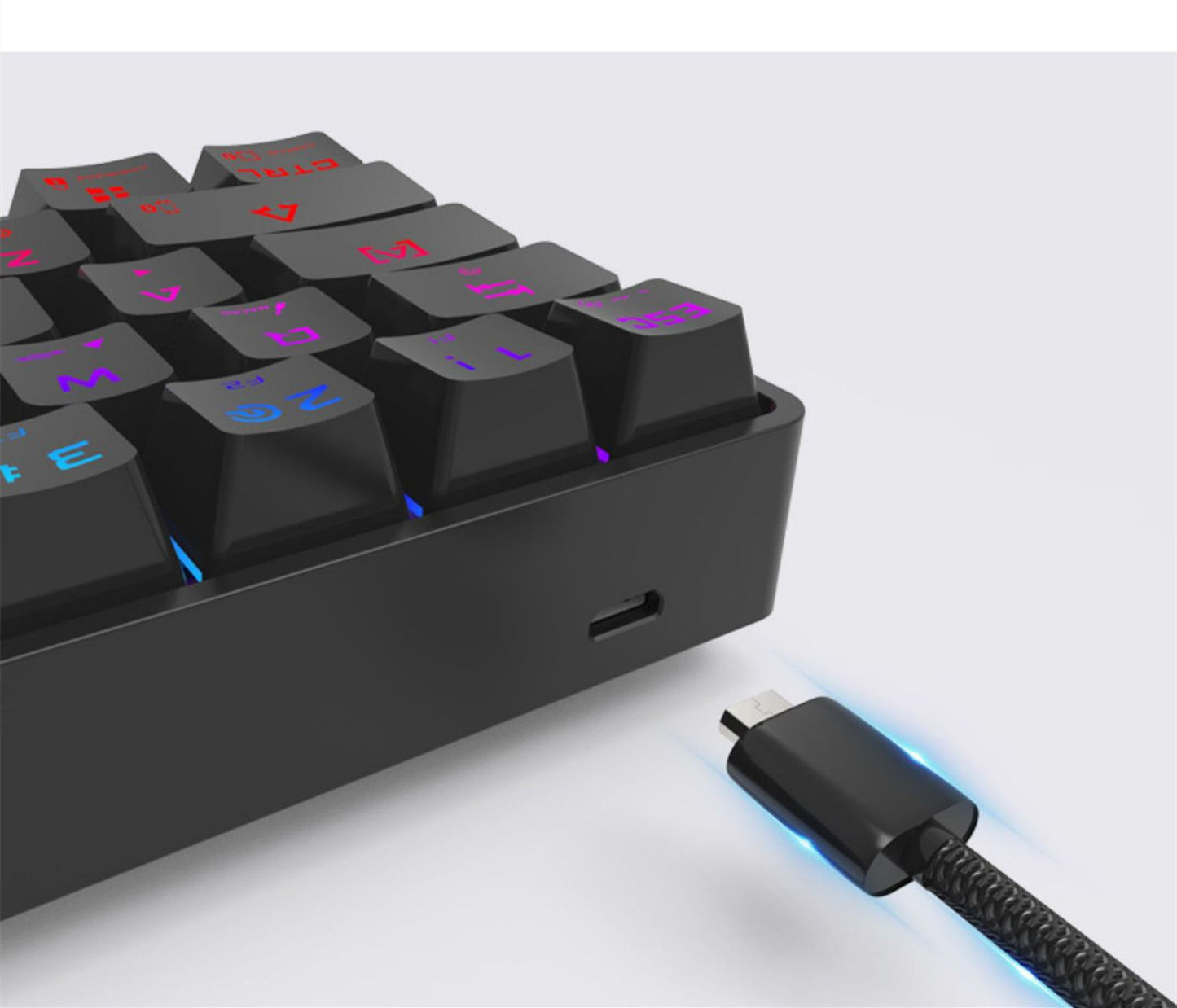 Black mechanical keyboard with RGB lighting on a white background