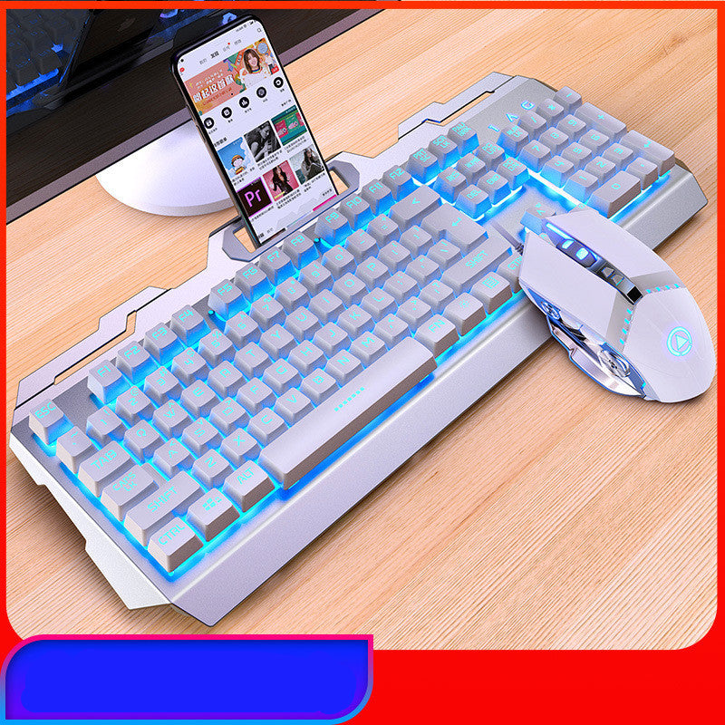 Mechanical keyboard with RGB lighting and a mouse on a desk, with a smartphone displaying a video.