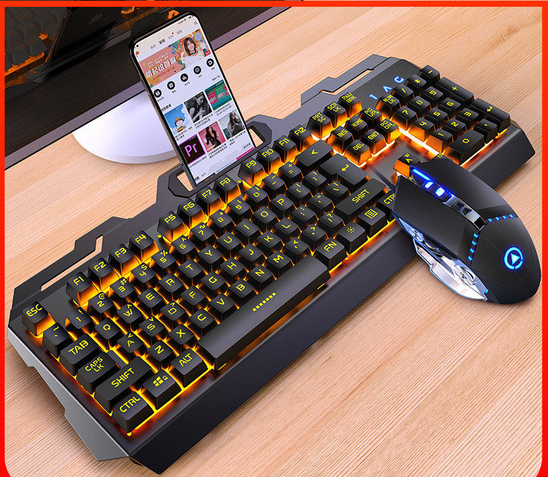 Gaming keyboard and mouse set on a wooden desk with a smartphone displaying content.