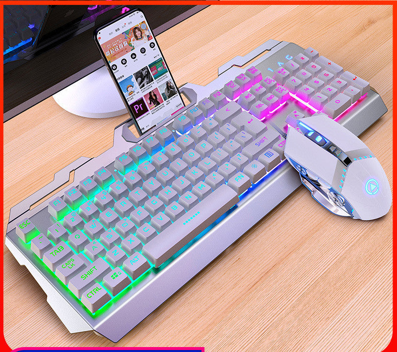 Gaming keyboard and mouse set with smartphone on a wooden desk