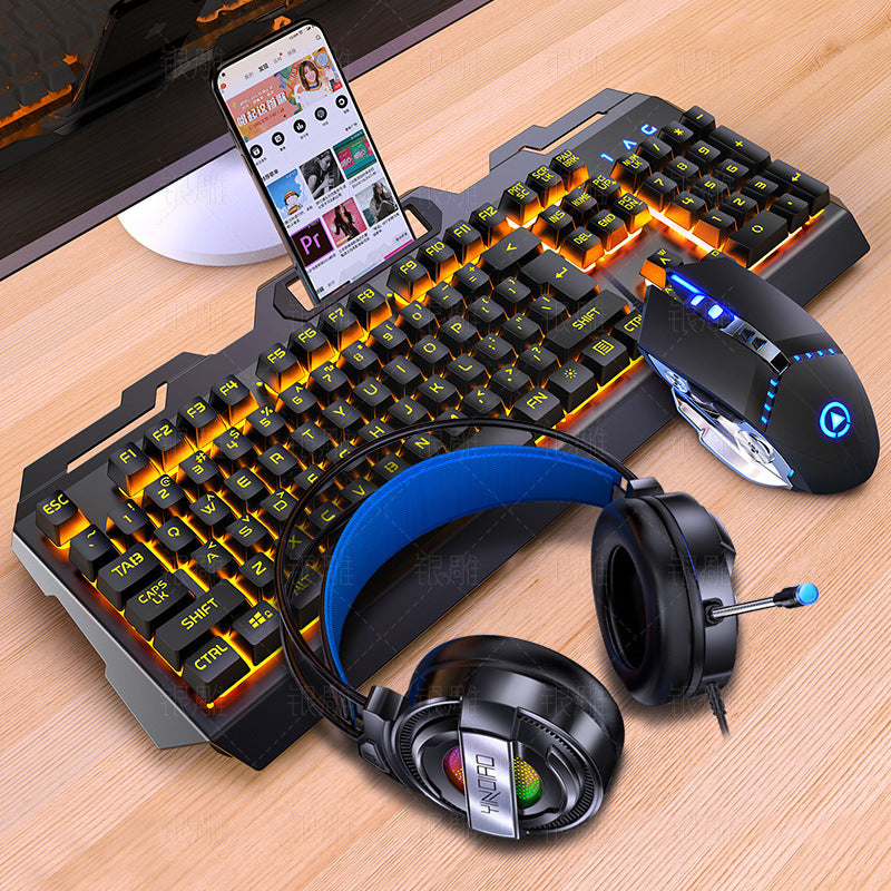 Gaming keyboard, mouse, and headphones on a wooden surface with a smartphone displaying content.