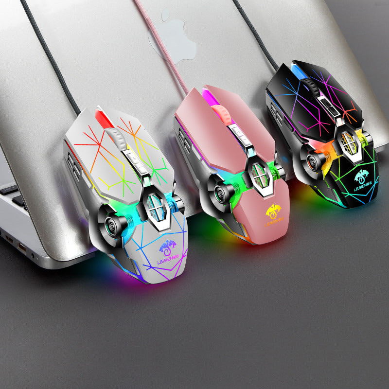 Three colorful gaming mice with RGB lighting on a laptop.
