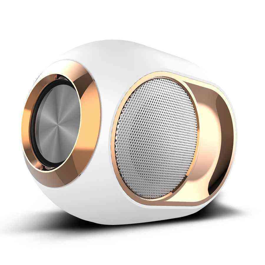 White and gold portable speaker on a white background