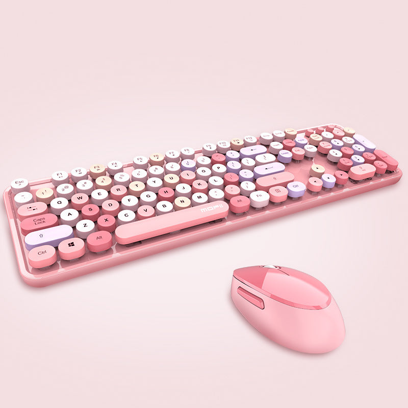 Pink keyboard and mouse set on a light pink background