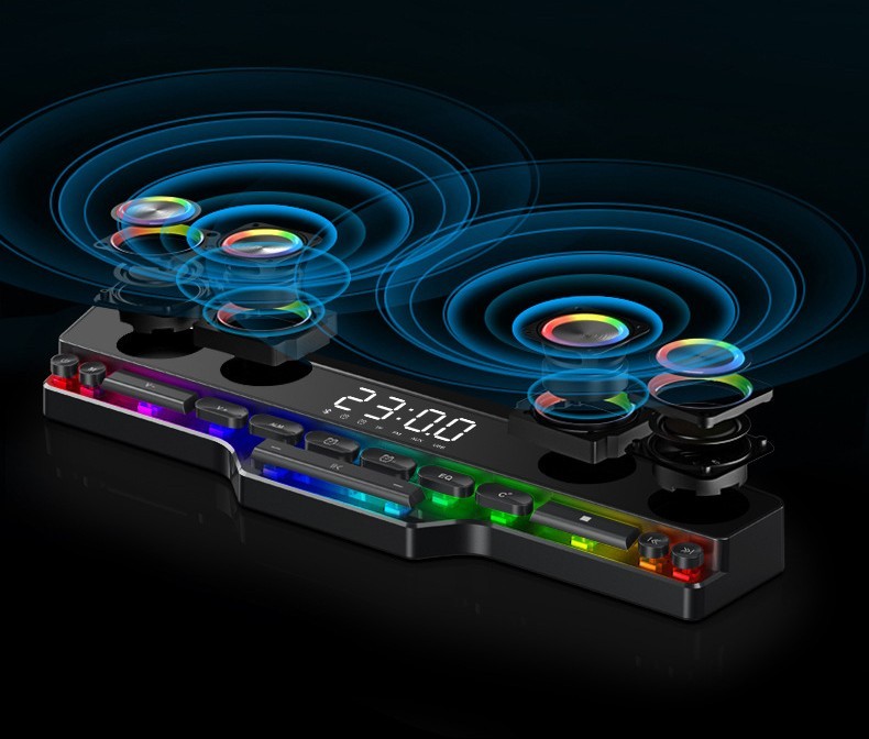 Gaming desk with RGB lighting and digital clock on a dark background