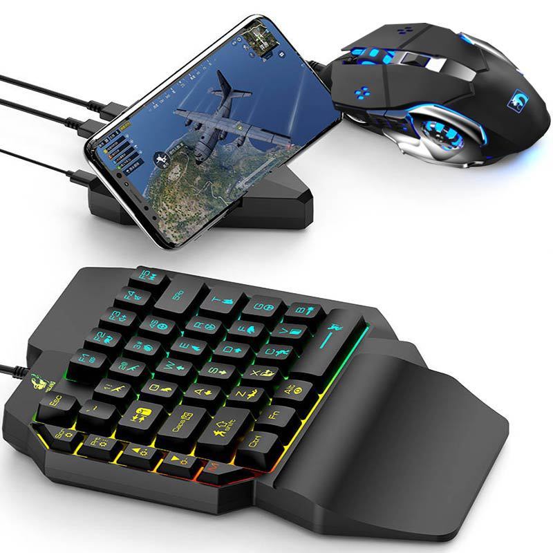 Gaming keyboard, mouse, and smartphone setup on a white background