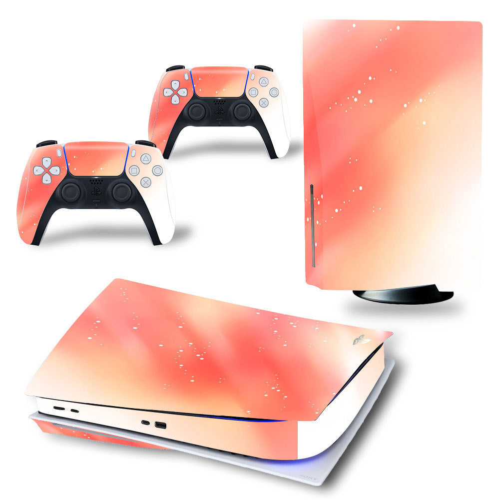 Gaming console and controllers with a gradient pink and orange design