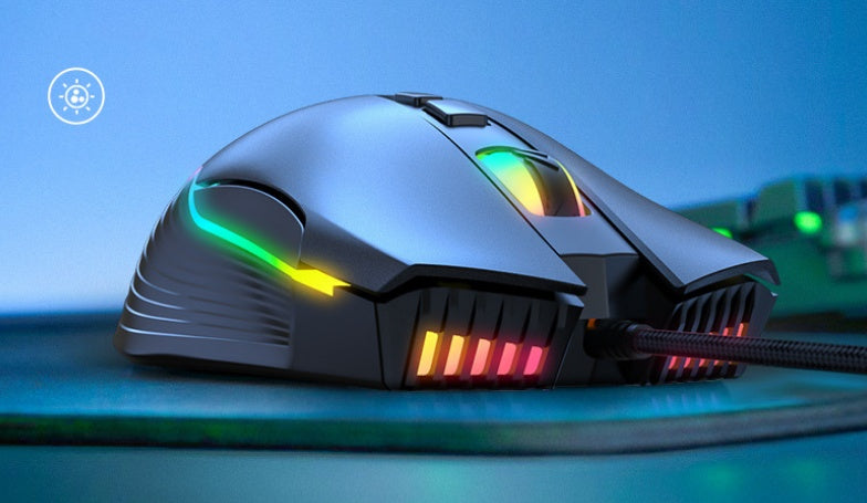 Gaming mouse with RGB lighting on a blue surface