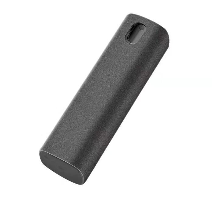 Black cylindrical device on a white background