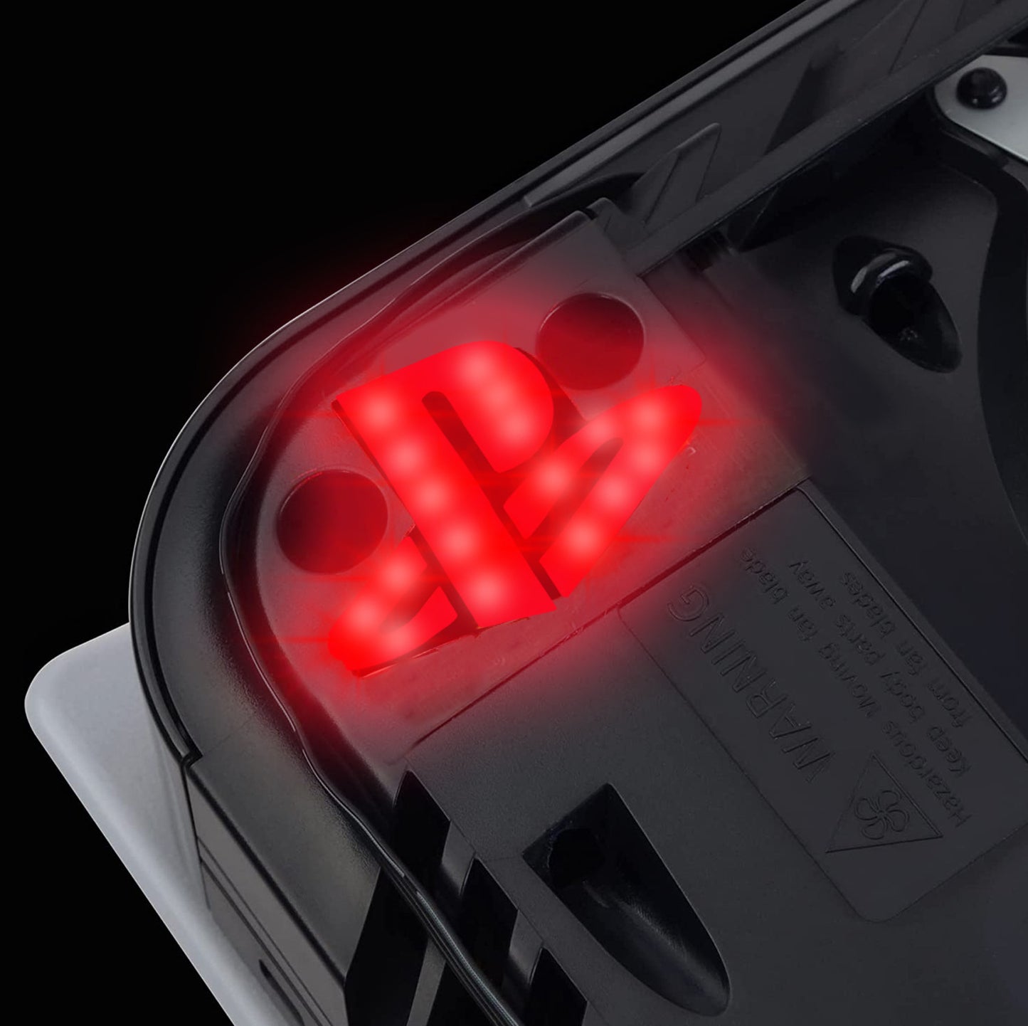 Close-up of a device with red LED lights on a black background
