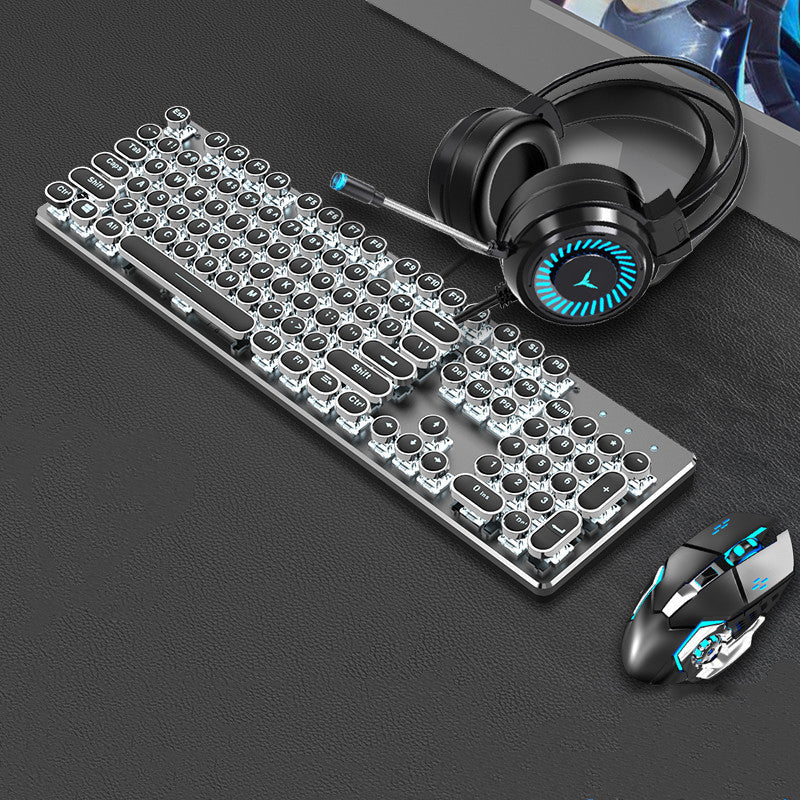 Gaming keyboard, mouse, and headset on a dark surface