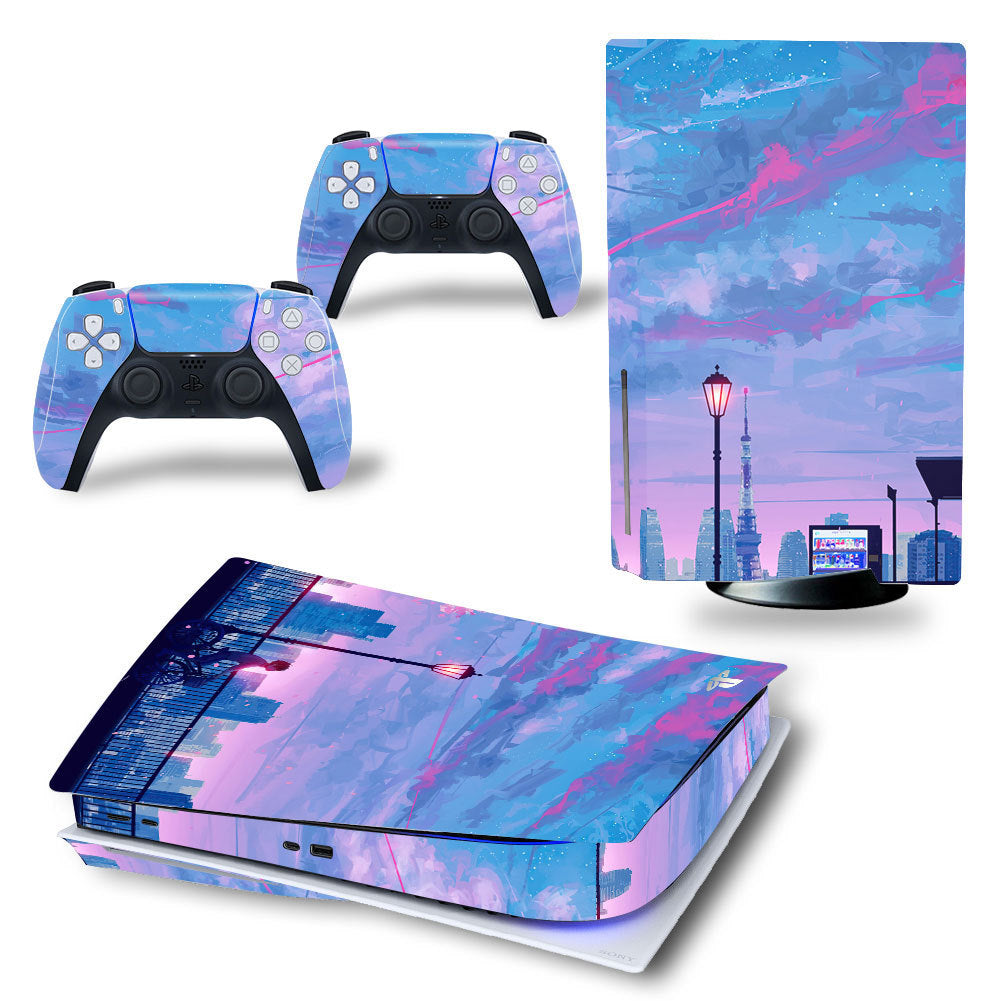 Gaming console and controllers with a cityscape design decal on a white background