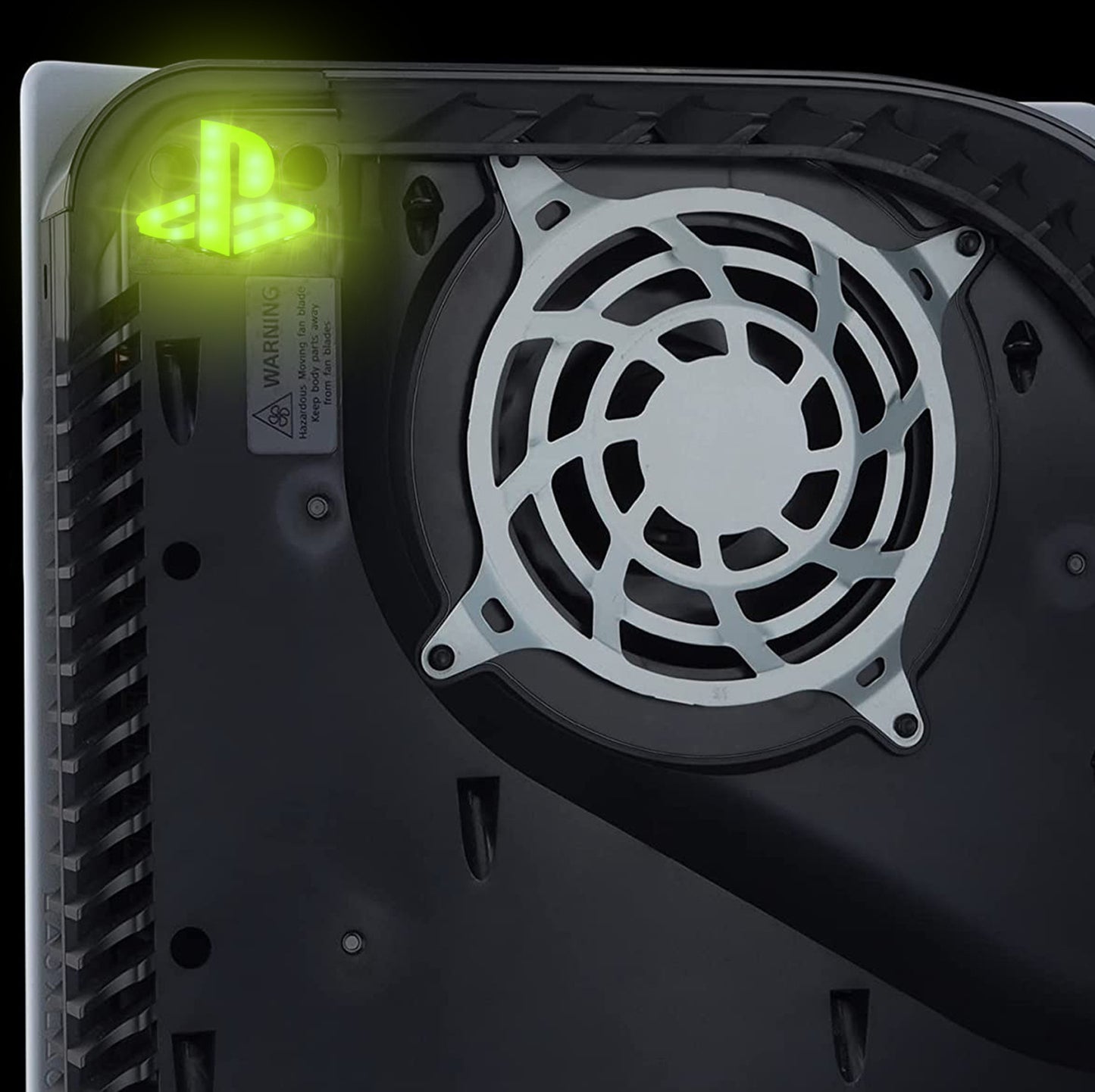 Close-up of a computer case fan with glowing green logo on a black background