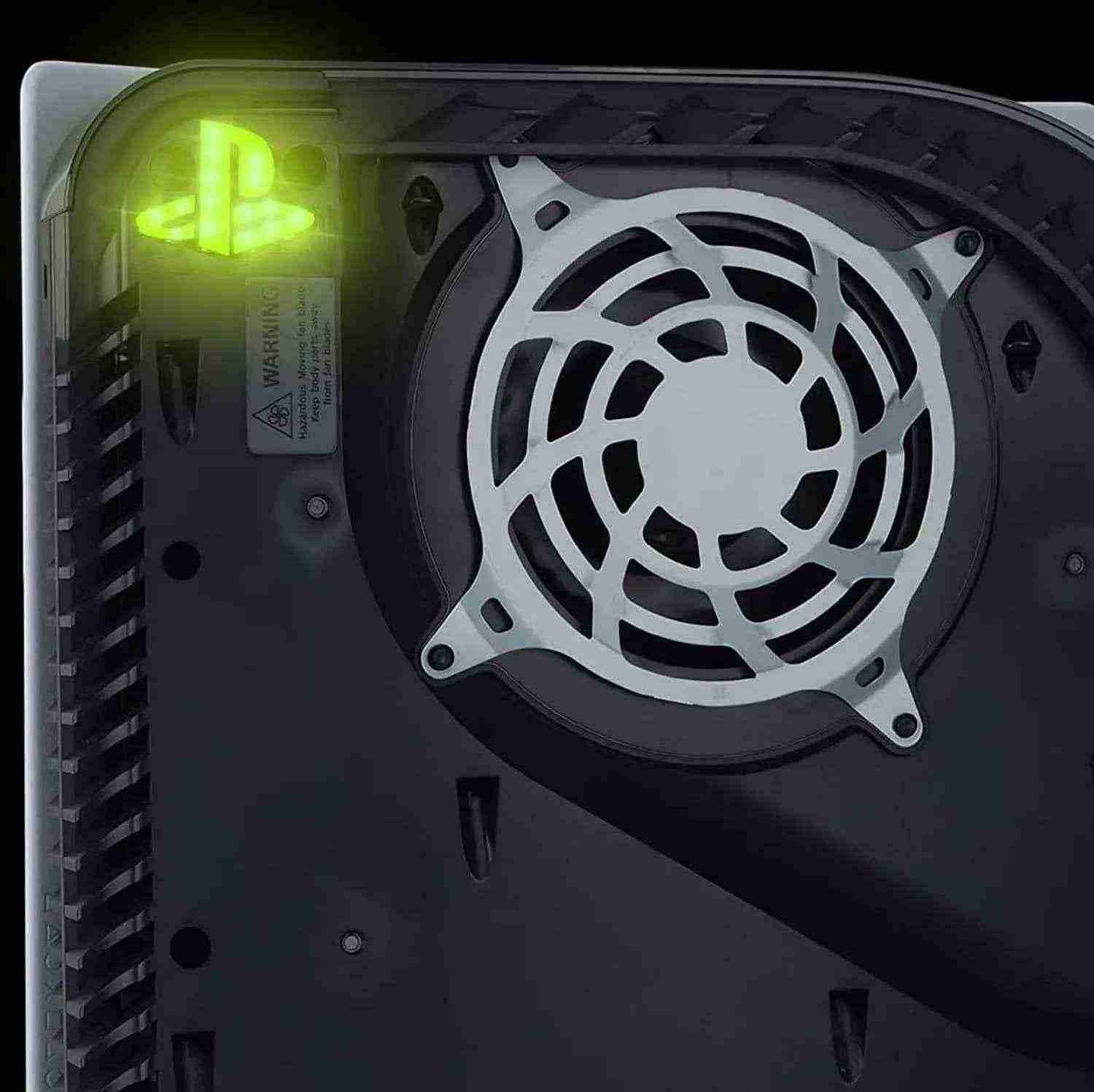 Close-up of a computer case fan with a green light indicator on a black background