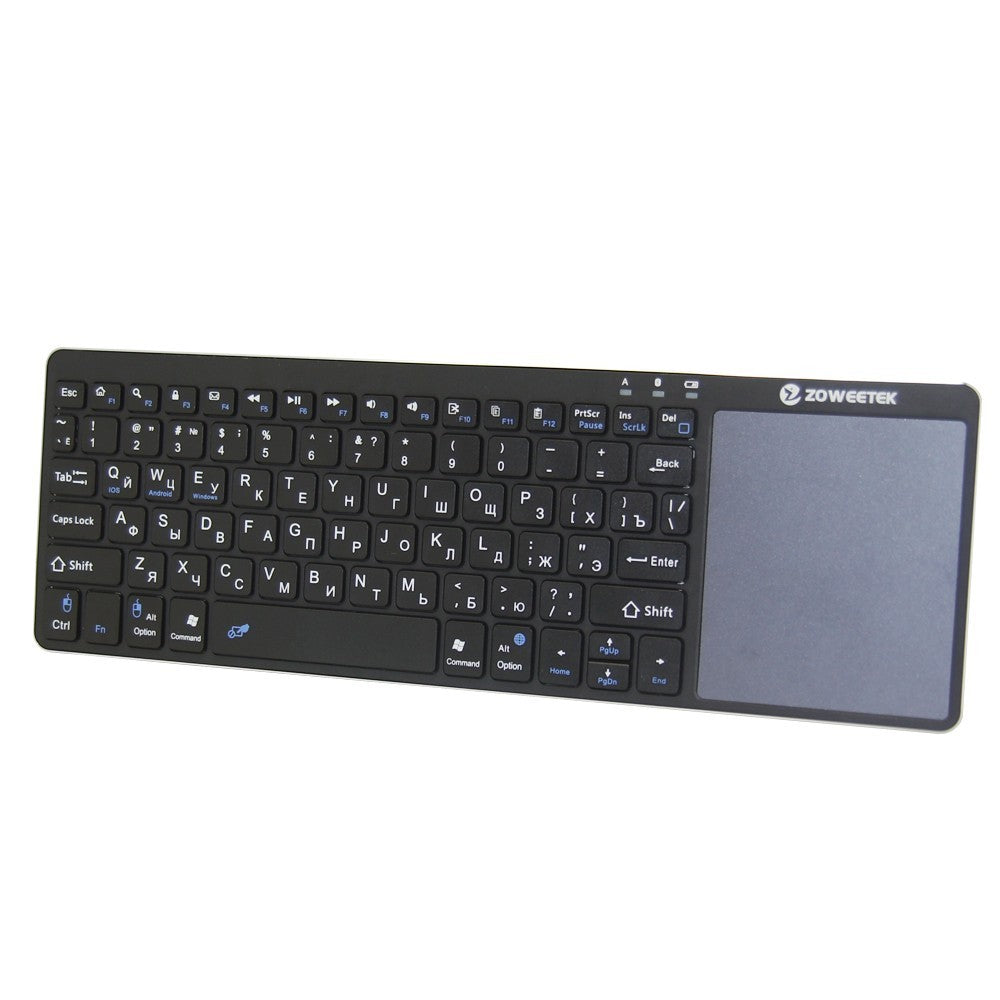 Black keyboard with touchpad on a white background