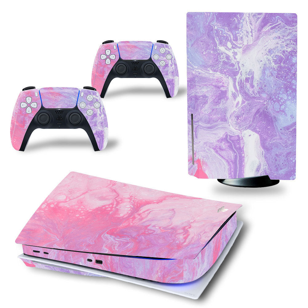 Gaming console and controllers with pink and purple marble design on a white background