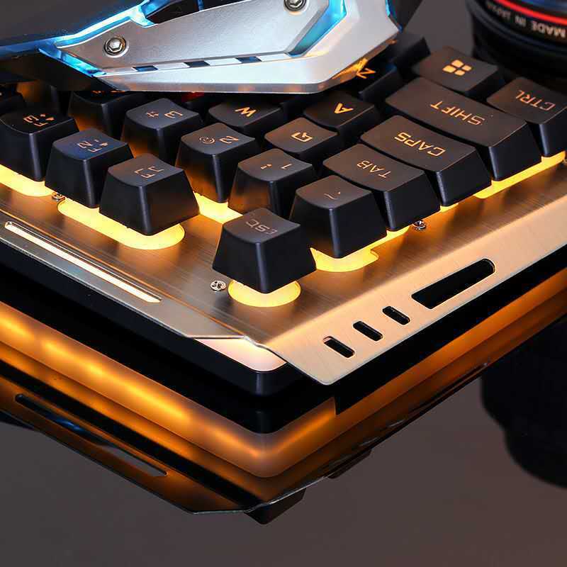 Close-up of a mechanical keyboard with glowing underglow on a dark background