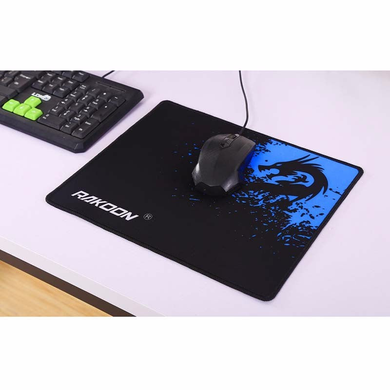 Mouse pad with dragon design and RiiKoon branding on a desk with keyboard and mouse.