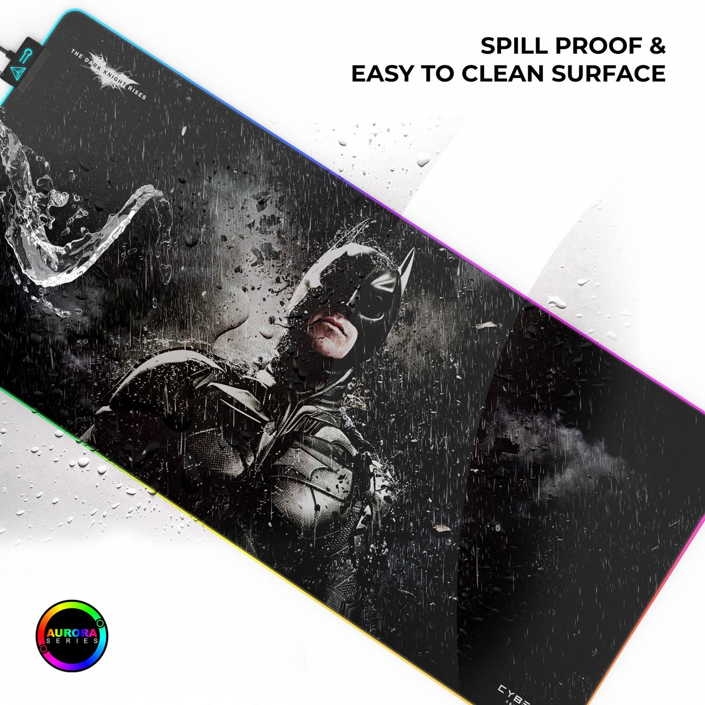 Large mouse pad with superhero design and text about spill-proof surface, brand 'Aurora' visible.