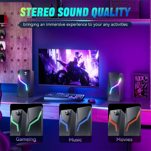 Gaming setup with stereo speakers labeled for different activities on a purple-themed wall.