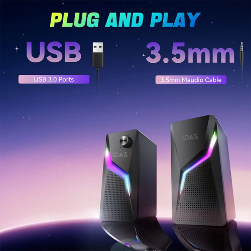 Speakers with USB and 3.5mm cable on a space-themed background