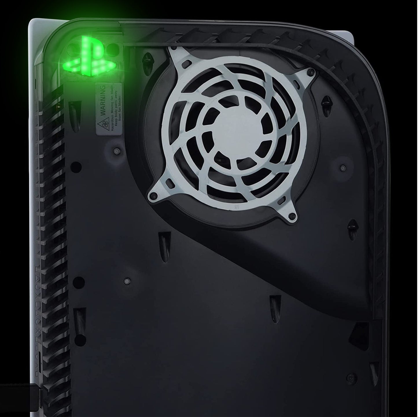 Close-up of a computer case with a cooling fan and green LED light on a black background