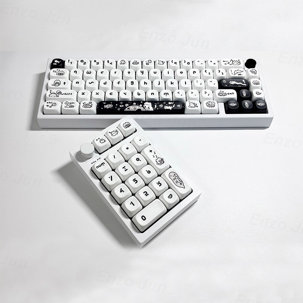 White keyboard with cartoon character keys on a light gray background