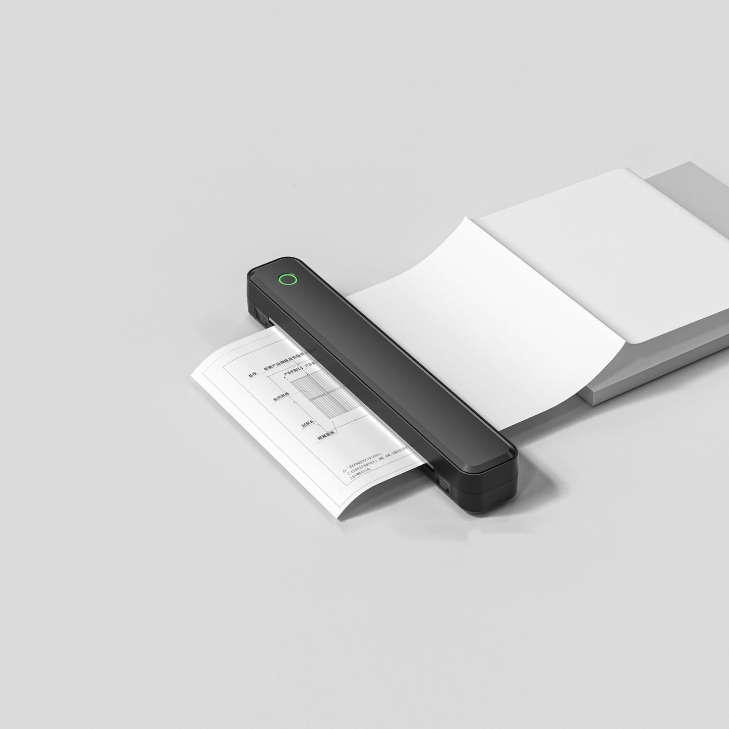 Black handheld scanner scanning a document on a light gray background