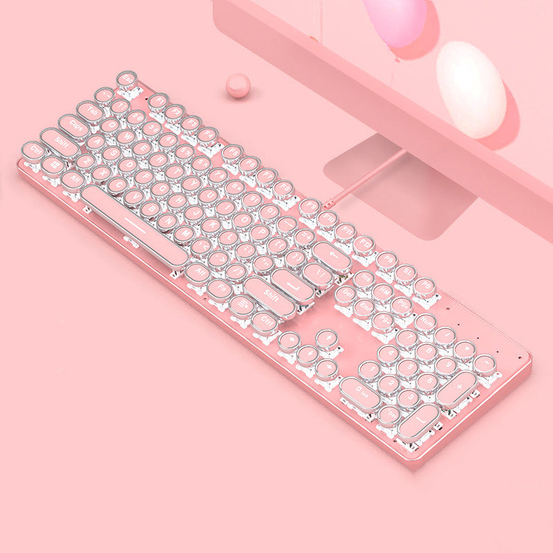 Pink and silver keyboard on a pink background