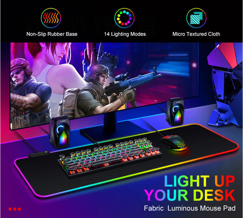 Gaming setup with illuminated mouse pad, keyboard, and mouse on a dark background