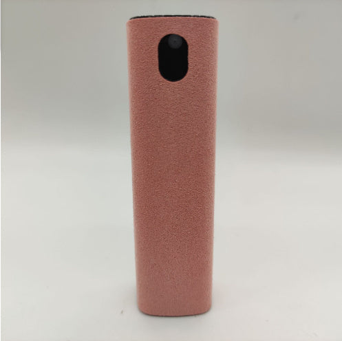 Pink cylindrical object with a black circular feature on a light gray background