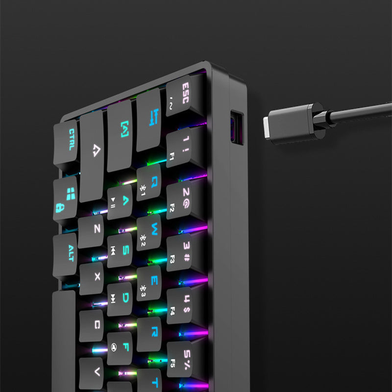 Compact keyboard with RGB backlighting on a dark background