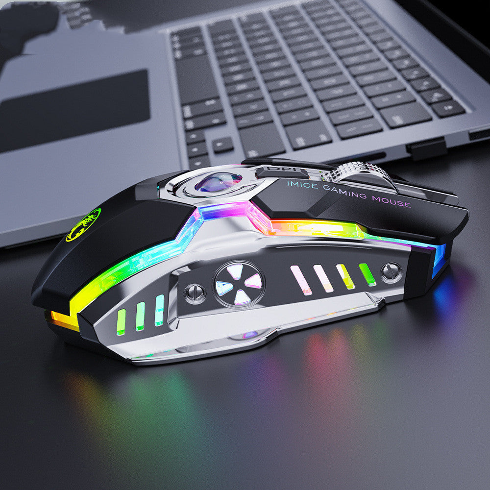 Gaming mouse with RGB lighting on a desk next to a laptop