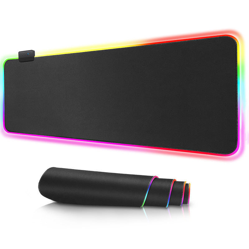 Black mouse pad with colorful LED lighting on a white background