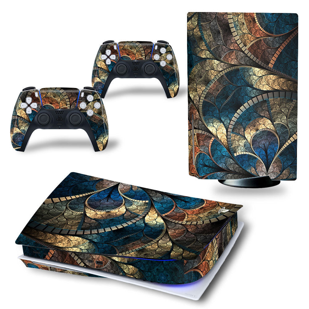 Gaming console and controllers with a decorative skin featuring geometric patterns.
