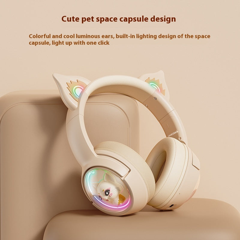White headphones with cat ear design and colorful lighting on a beige background