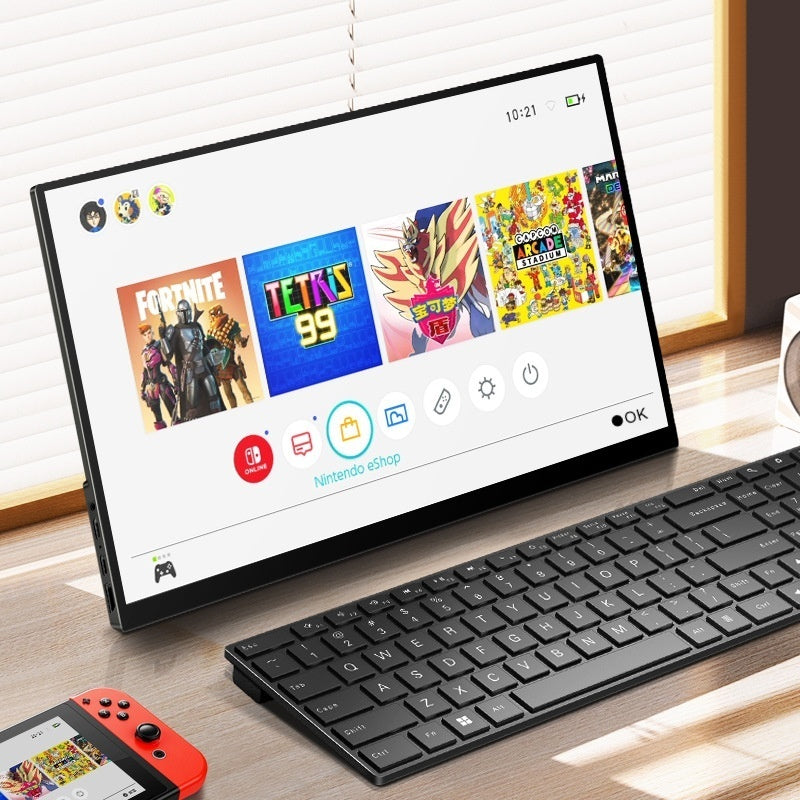 Tablet with gaming interface on a desk with keyboard and Switch controller