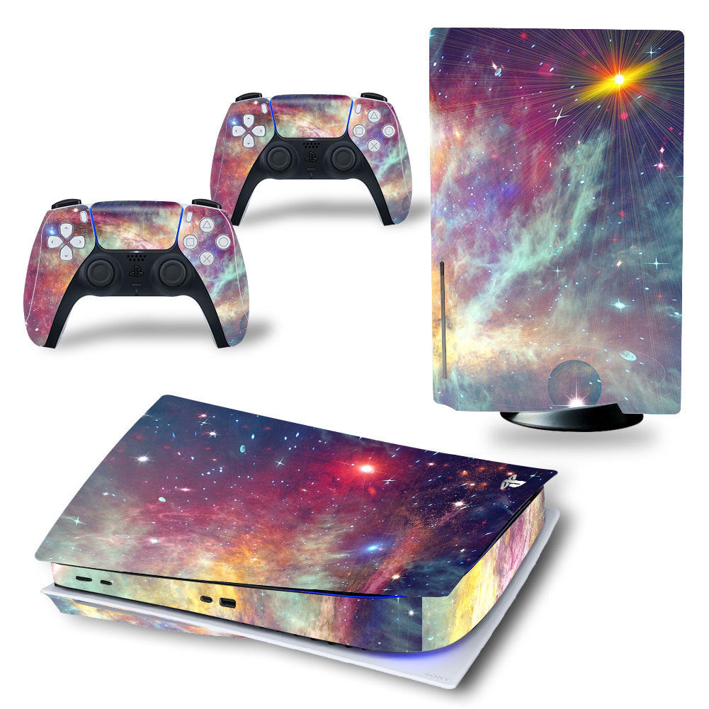 Gaming console and controllers with a colorful nebula design on a white background