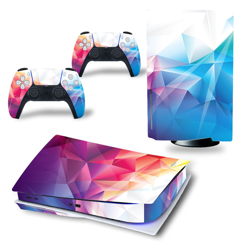Gaming console and controllers with colorful geometric skin design on a white background