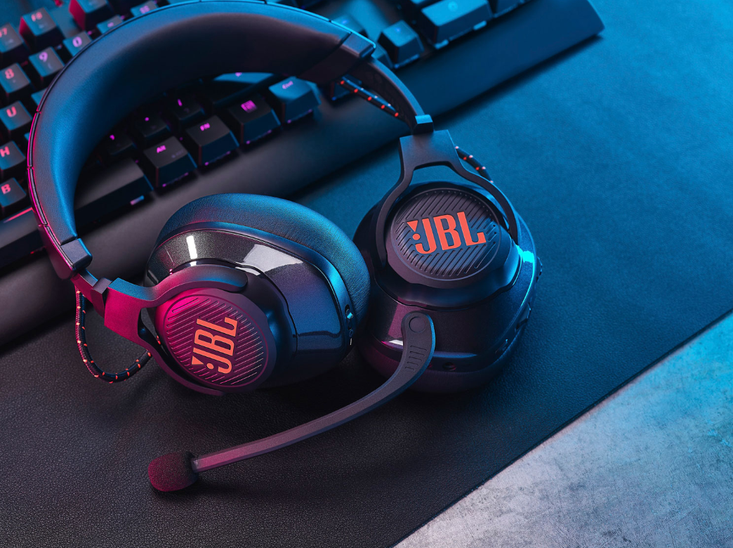 JBL gaming headset on a desk with keyboard in the background