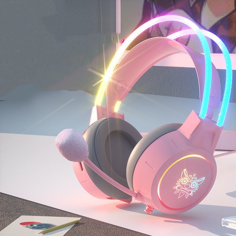 Pink gaming headset with colorful lights on a white surface