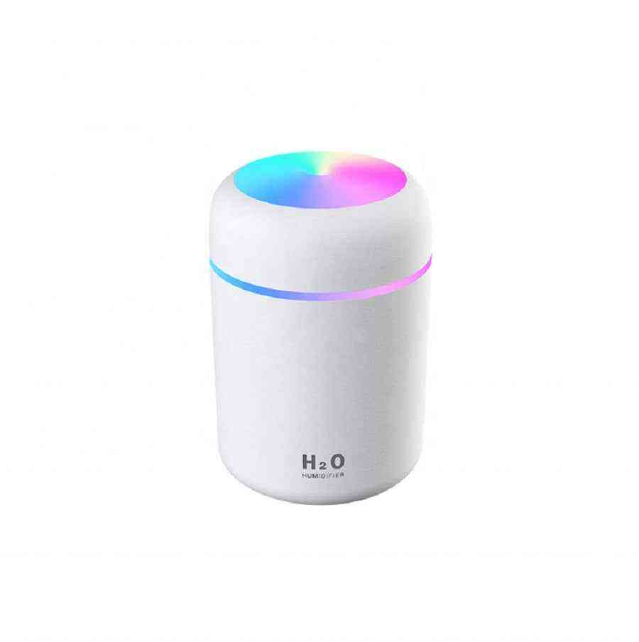 White humidifier with colorful LED light on a white background