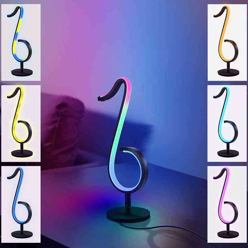 Neon light shaped like a musical note with RGB color changes on a gradient background.